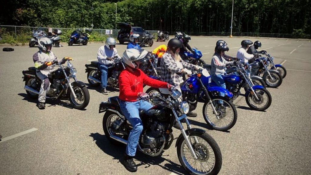 motorcycles students learning to ride grouped together on their motorcycles