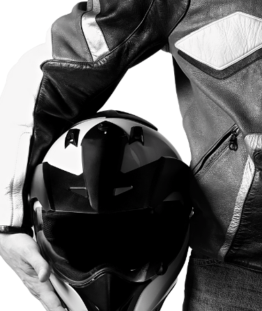 close up on motorcycle instructor holding helmet again hip